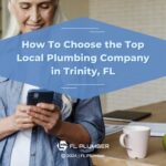 A woman at home on her phone appears relieved, with overlay text highlighting how to choose a local plumber in Trinity, FL.